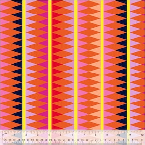 May include: A colourful geometric fabric design. The pattern features repeating diamond shapes in orange, pink, and navy blue, with vertical yellow stripes. Suitable for craft projects. The ruler shows measurements in cm.