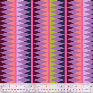 May include: Fabric with a geometric pattern of diamond shapes in purple, pink, navy, and green, arranged in vertical stripes. A ruler along the bottom edge shows measurements in centimetres.