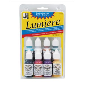 May include: A pack of Lumiere Exciter Pack metallic paints. The package contains eight bottles of various metallic colours. The packaging is yellow and blue with the brand name and product information printed on it. Each bottle contains 14.79 ml of paint.
