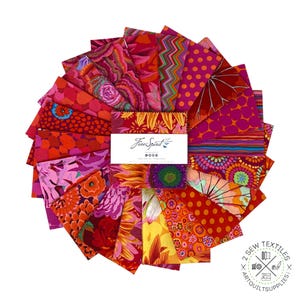 May include: A collection of 18 red, orange, pink and yellow fabric squares with floral and geometric patterns. The fabric squares are arranged in a fan shape and feature the text "Free Spirit" in the centre.