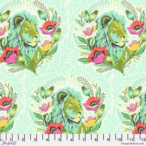May include: A green and blue lion's head with a floral design in shades of pink, white, and yellow on a light green background.
