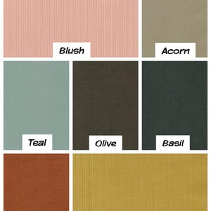 May include: A collection of nine fabric swatches in various colors, including blush, acorn, teal, olive, basil, russet, and mustard. The fabric has a corduroy texture.