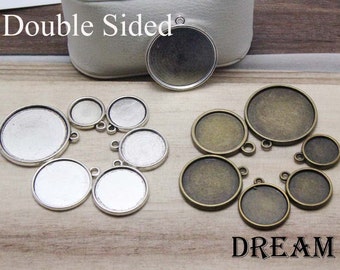 May include: Double sided, silver and bronze colored metal round pendant trays with a variety of sizes.  The text "Double Sided" and "DREAM" are visible in the image.