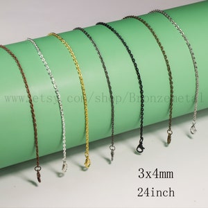 May include: A set of 24-inch chain necklaces in various colours, including bronze, silver, gold, and black. The chains are 3x4mm in size and have a lobster clasp closure.