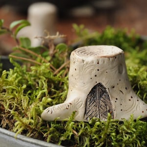 Miniature tree stump with a fairy door