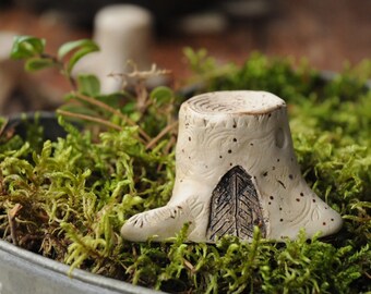 Miniature tree stump with a fairy door