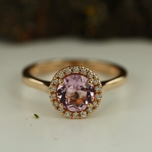 Natural pink morganite surrounded by a sparkling halo of vibrant and brilliant cut natural diamonds in 14k rose gold