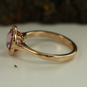 Natural pink morganite surrounded by a sparkling halo of vibrant and brilliant cut natural diamonds in 14k rose gold