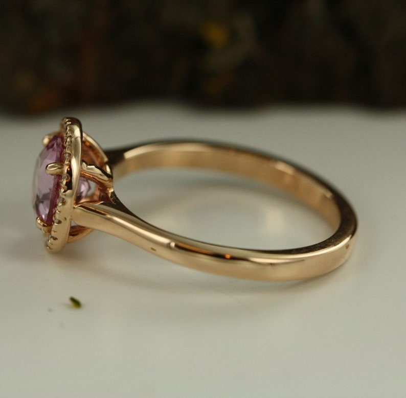 Natural pink morganite surrounded by a sparkling halo of vibrant and brilliant cut natural diamonds in 14k rose gold