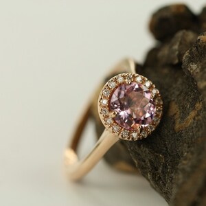 Natural pink morganite surrounded by a sparkling halo of vibrant and brilliant cut natural diamonds in 14k rose gold