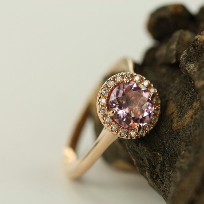 Natural pink morganite surrounded by a sparkling halo of vibrant and brilliant cut natural diamonds in 14k rose gold