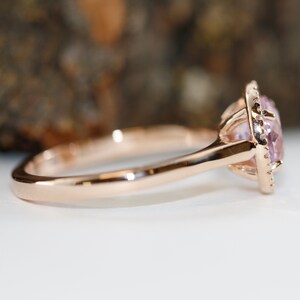 Natural pink morganite surrounded by a sparkling halo of vibrant and brilliant cut natural diamonds in 14k rose gold