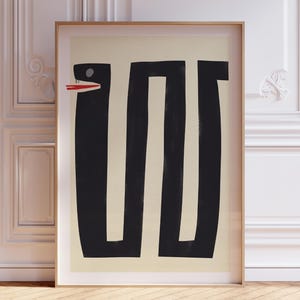 May include: A black and white abstract art print of a snake with a red mouth. The snake is in a simple, geometric style.