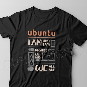 May include: Black t-shirt with a graphic design featuring the word "ubuntu" in orange and the text "I AM WHAT I AM BECAUSE OF WHO WE ALL ARE" in white. The graphic also includes a computer keyboard, mouse, glasses, and a laptop.