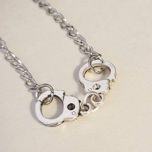 Handcuff charm necklace