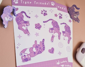 Puede incluir: Una hoja de pegatinas moradas y blancas con tigres de dibujos animados en varias poses. Las pegatinas están decoradas con estrellas, huellas de patas y remolinos. La hoja incluye el texto "Tiger Friends!" y "Swiftterly".