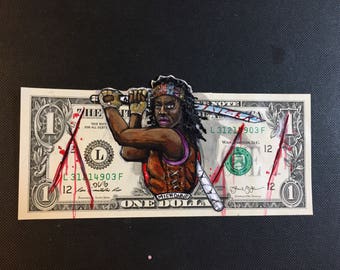 Michonne painted on a dollar bill