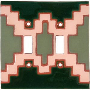 May include: A double light switch cover with a geometric pattern in shades of green, pink, and gray. The pattern is reminiscent of a Southwestern design.