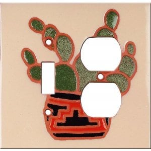 May include: A ceramic light switch and outlet cover with a cactus design. The cactus is green and has a red pot with black and white geometric designs.