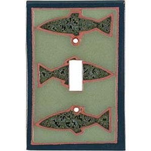 May include: Decorative light switch cover featuring three fish designs in a green and black speckled pattern. The fish are outlined in a reddish-brown color, set against a light green background. The cover has a single switch opening.