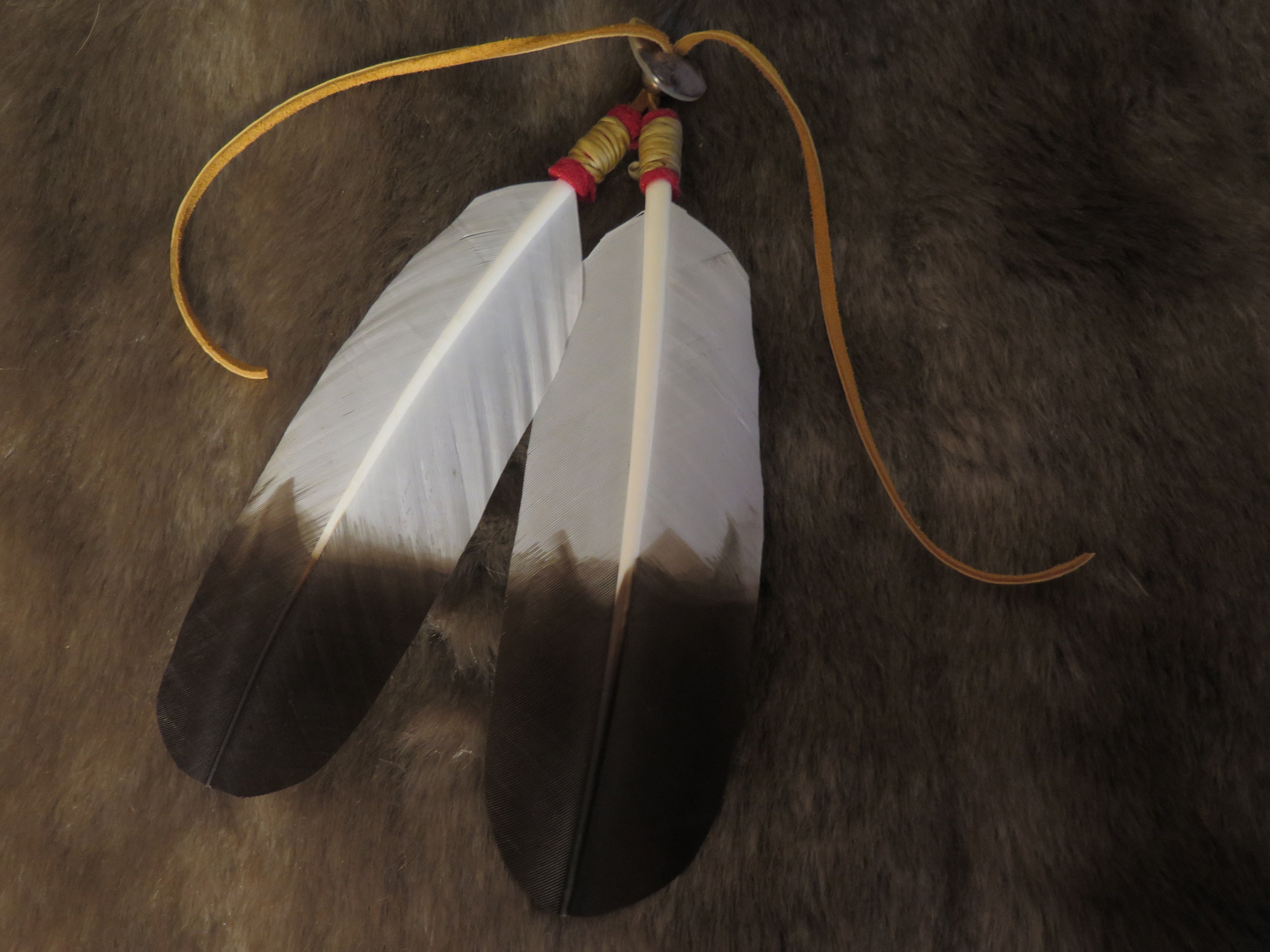 Native American Hair Tie as part of your Regalia hand made Golden Eagle  Feathers are attached that's the Symbolism and Power