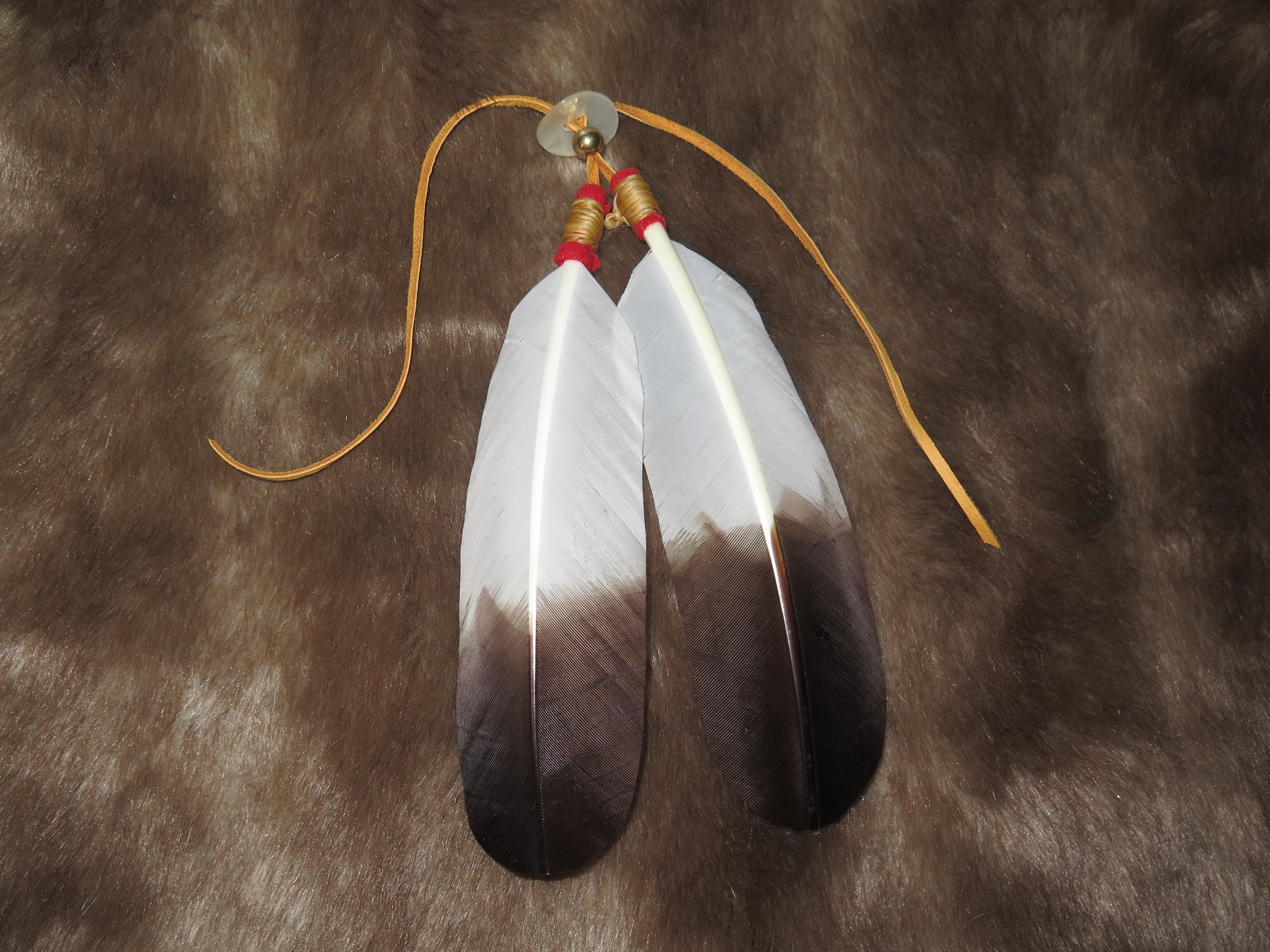 Native American Hair Tie as part of your Regalia hand made Golden Eagle  Feathers are attached that's the Symbolism and Power