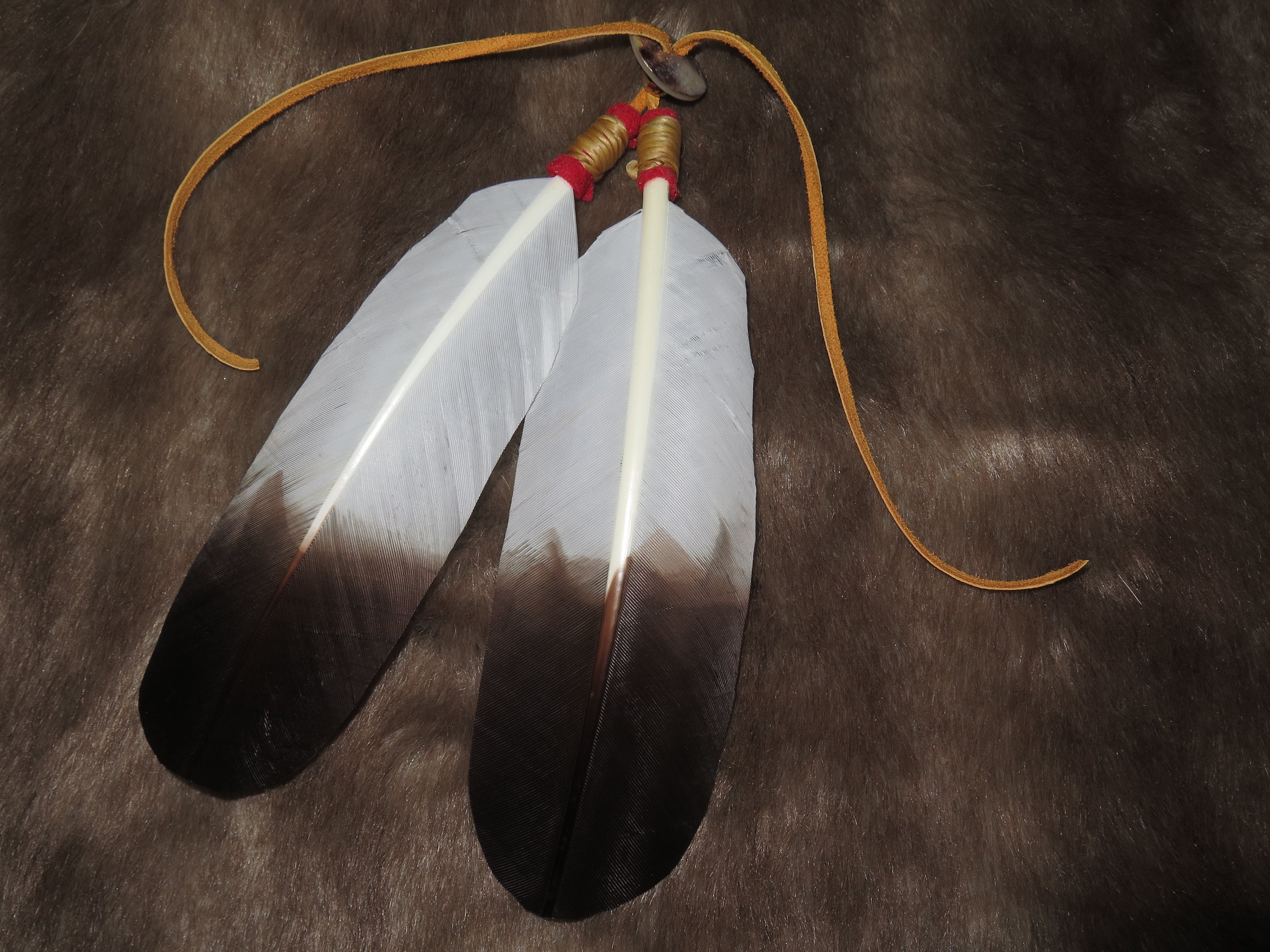 Native American Hair Tie as part of your Regalia hand made Golden Eagle  Feathers are attached that's the Symbolism and Power