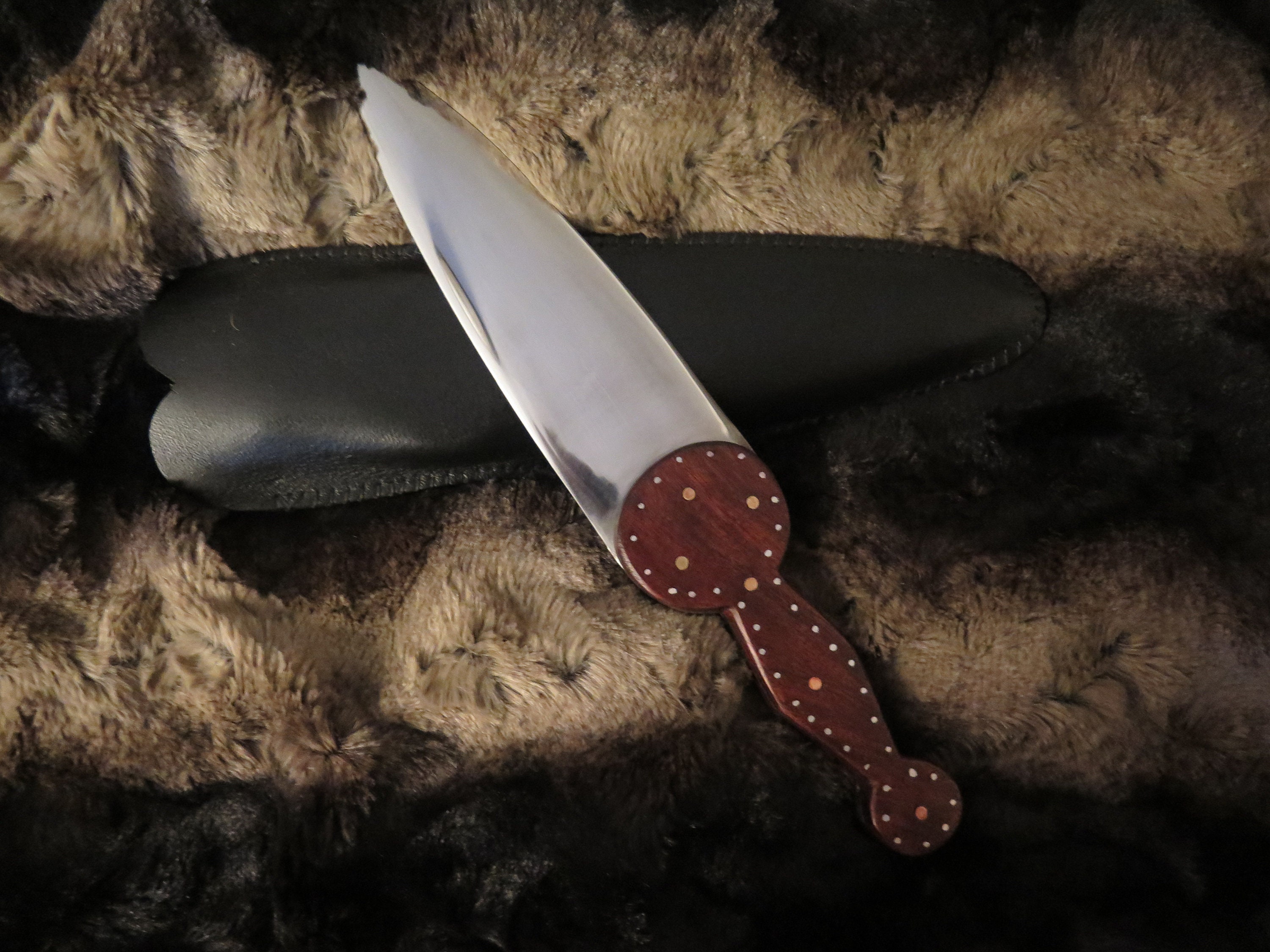 Cree Northern Plains Knife heavily decorated brass and steel pins in a