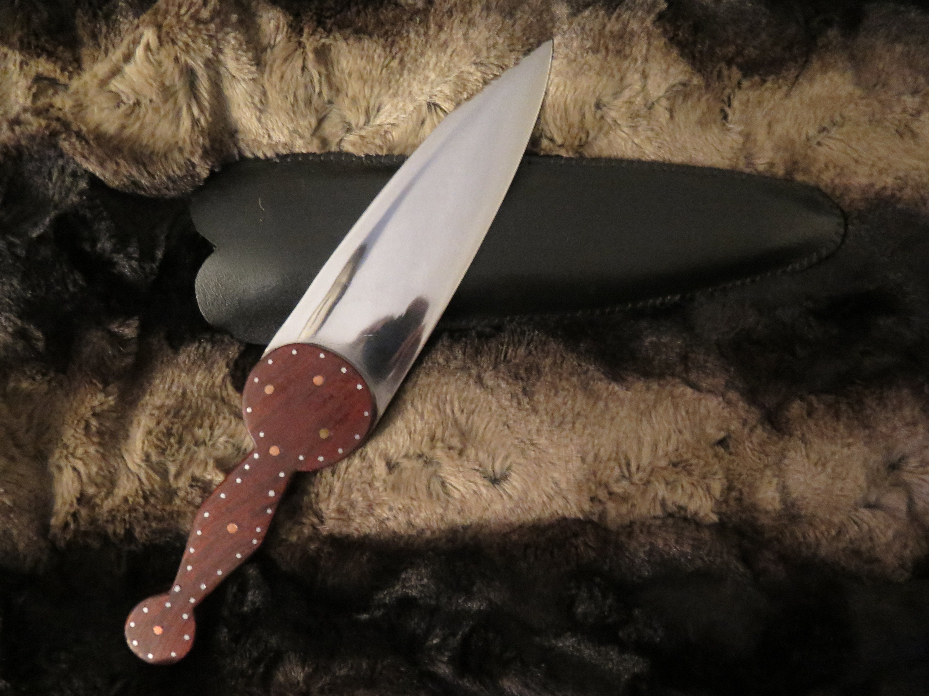 Cree Northern Plains Knife heavily decorated brass and steel pins in a