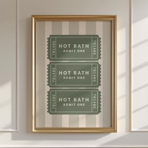 May include: A framed print with a striped background and three green tickets that say "Hot Bath, Admit One" with the number 701406 on each ticket.