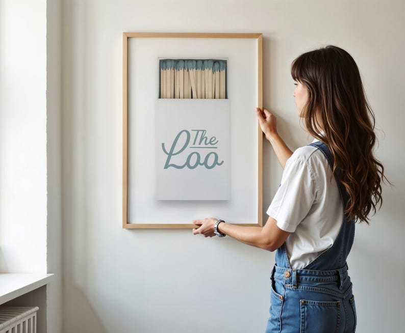 Bathroom Matchbook Print with The Loo written in cursive on the matchbook