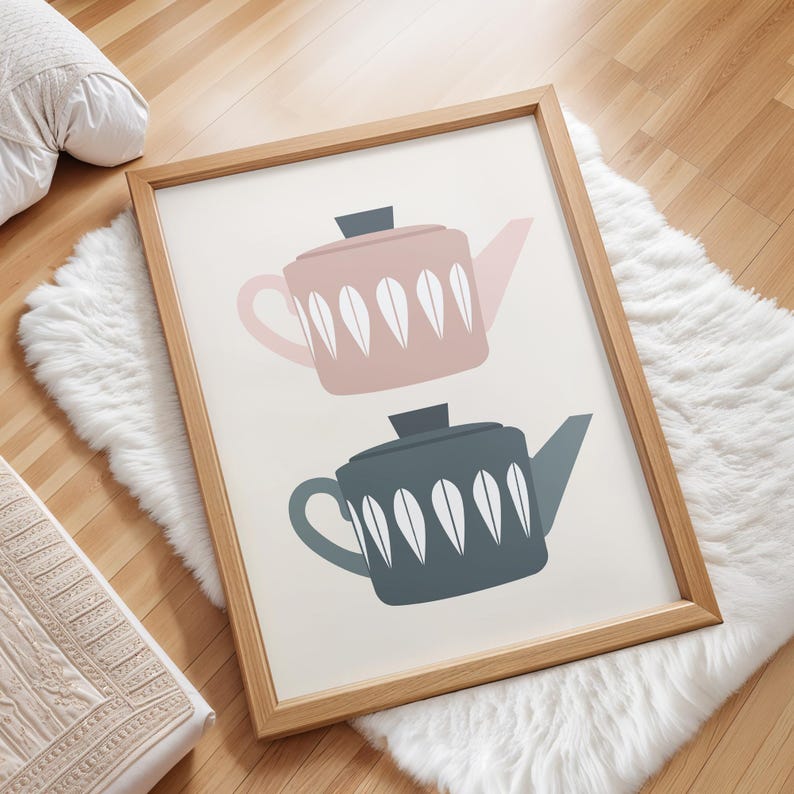 May include: A framed print with a minimalist design featuring two teapots. The top teapot is pink with white leaf-like patterns. The bottom teapot is blue with white leaf-like patterns.