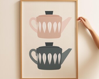 May include: A framed print of two teapots, one pink and one grey, with white leaf designs. The teapots are stacked on top of each other.