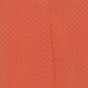 May include: A solid coral red fabric with a white plus sign pattern.