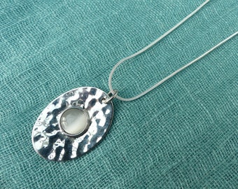 Vintage 1970s Hammered Silver-plated Oval Pendant With White Moonglow Lucite Cabochon, on Silver-Plated Snake Chain