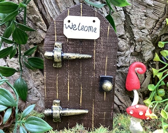 Rustic wooden brown fairy door. Lawn decoration, fairy garden elf or pixie door.  Yard art, hanging door for inside or out with welcome sign