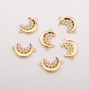 Puede incluir: Seis abalorios de media luna de color dorado con detalles de strass transparentes. Los abalorios tienen dos anillos de salto para sujetarlos a joyas.