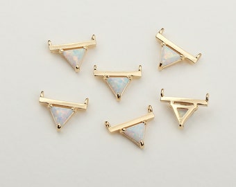 May include: Six gold-tone triangle pendant charms with opal-like stones. Each charm has a horizontal bar across the top.