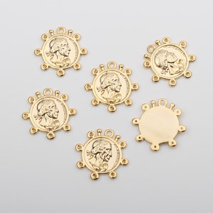 May include: Six gold-toned metal charms with a circular design. Each charm features a raised profile of a person's face and a circle of small holes around the edge. One charm has a blank circular center.