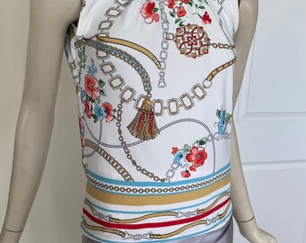 Sleeveless Mock Neck Tank Top. Stretch Jewel Pattern Top. Available in Sizes S, M, L.