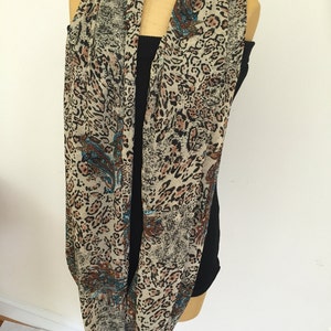 Woman&#39;s Brown Black Blue Red and Gold Leopard Print Infinity Loop Scarf