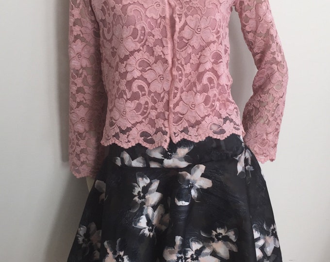 Tea Rose and Grey Ensemble. Women's Blush Pink Turtle Neck Top with Cap Sleeves, Lace Jacket, and Grey Jacquard Floral Skirt.
