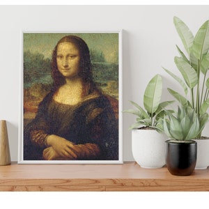 May include: A framed print of the Mona Lisa painting, a famous portrait of a woman with a subtle smile, against a backdrop of a landscape. The print is displayed on a wooden shelf with potted plants.