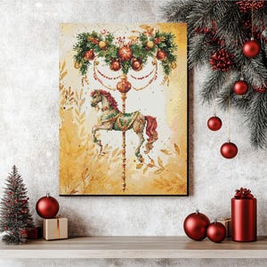 May include: A framed print of a carousel horse with a festive Christmas garland. The horse is tan, green, and red, with a gold pole. The background is a soft yellow with leaf accents. Red ornaments and a small Christmas tree are on the shelf.