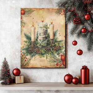 May include: A rectangular canvas print depicting three lit candles surrounded by greenery and pine cones. The print has a vintage, watercolour style with a warm, neutral background. Red baubles and a small Christmas tree are also visible.
