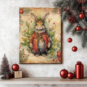 May include: A framed canvas print depicts a watercolour illustration of a rabbit in a red coat and leafy crown, surrounded by greenery and berries. The artwork has a vintage, rustic aesthetic, suitable for festive decorations.