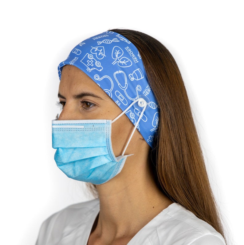 May include: A blue headband with a white medical themed pattern and button closures for holding a face mask. The headband says "HEALTHCARE HEROES" and "PRAY FOR THE WORLD".