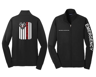 May include: Black zippered jacket with a white American flag design on the back and the word "EMERGENCY" in red lettering. The right sleeve has the word "EMERGENCY" in white lettering.