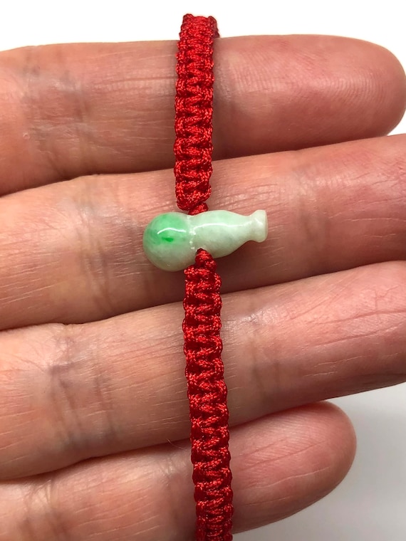 Chinese jade bracelet with red best sale string
