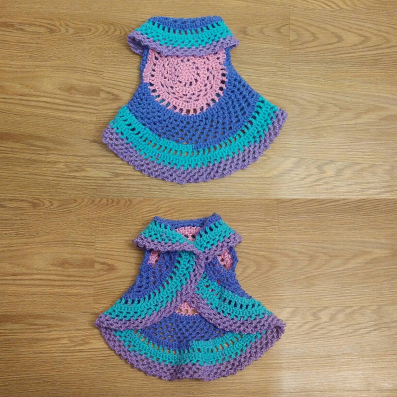 6-12 month size Multi-colored Hippie look. Round baby vest